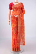 Brick Orange Silk Cotton Saree with Ikat design on the body and Zari Border.  displayed on a mannequin