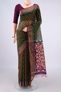 Bottle Green Silk Cotton Saree with Ikat design on the body and Zari Border.  displayed on a mannequin