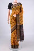 Yellow Silk Cotton Saree with Ikat design on the body and Zari Border.  displayed on a mannequin