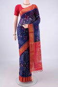 Dark Blue Silk Cotton Saree with Ikat design on the body and Zari Border.  displayed on a mannequin