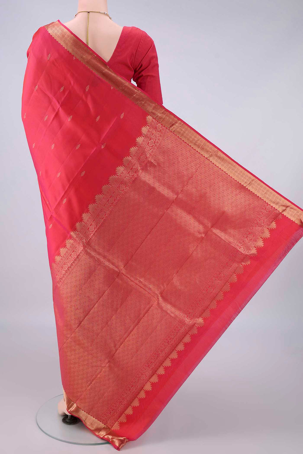 Flat view of Pure Silk Red Kanjivaram Saree with Zari Butta on the body and Zari Border. 