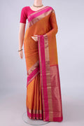 Pure Silk Brick Orange Dual Tone Kanchipuram Saree with Zari Butta on the body and Zari Border.  displayed on a mannequin