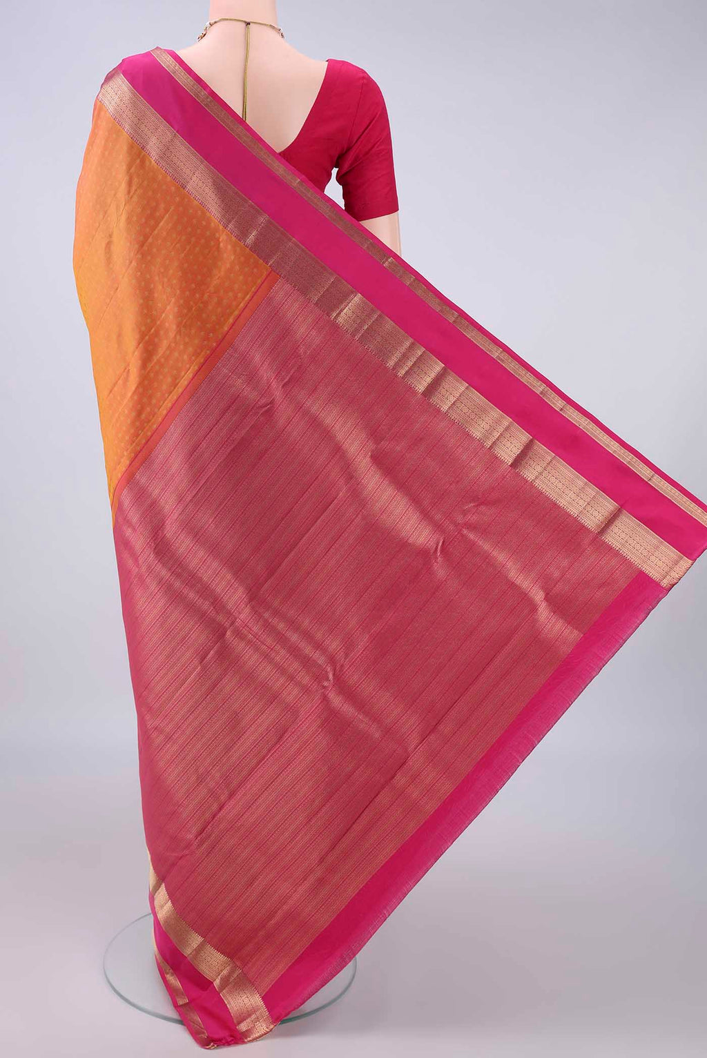 Flat view of Pure Silk Brick Orange Dual Tone Kanchipuram Saree with Zari Butta on the body and Zari Border. 
