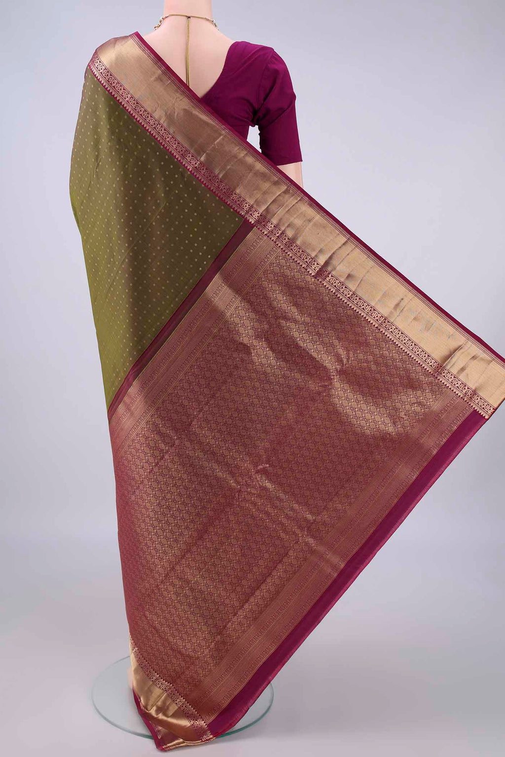 Flat view of Pure Silk Mehandi Green Kanchipuram Saree with Zari Butta on the body and Zari Border. 