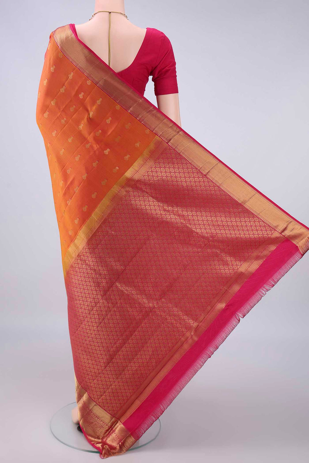 Flat view of Pure Silk Orange Dual Tone Kanjivaram Saree with Zari Butta on the body and Zari Border. 