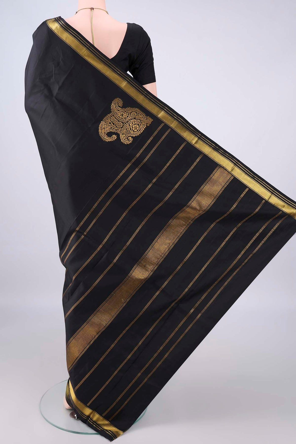 Flat view of Pure Silk Black Kanchipuram Saree with Plain Body and Zari Border. 