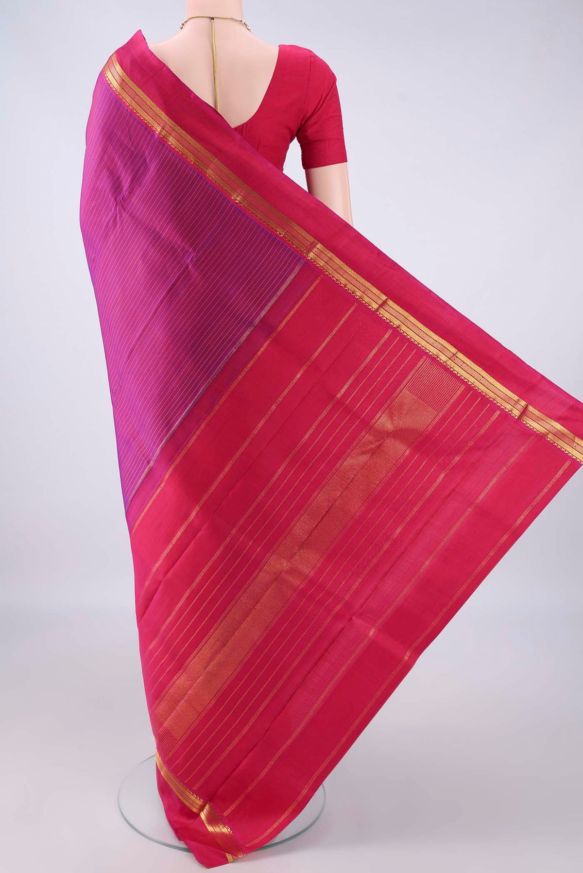 Flat view of Pure Silk Magenta Kanchipuram Saree with Stripes on the body and Zari Border. 