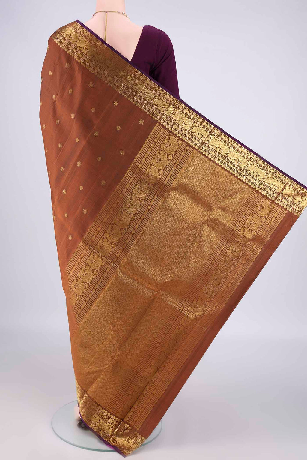 Flat view of Pure Silk Bronze Kanjivaram Saree with Zari Butta on the body and Zari Border. 