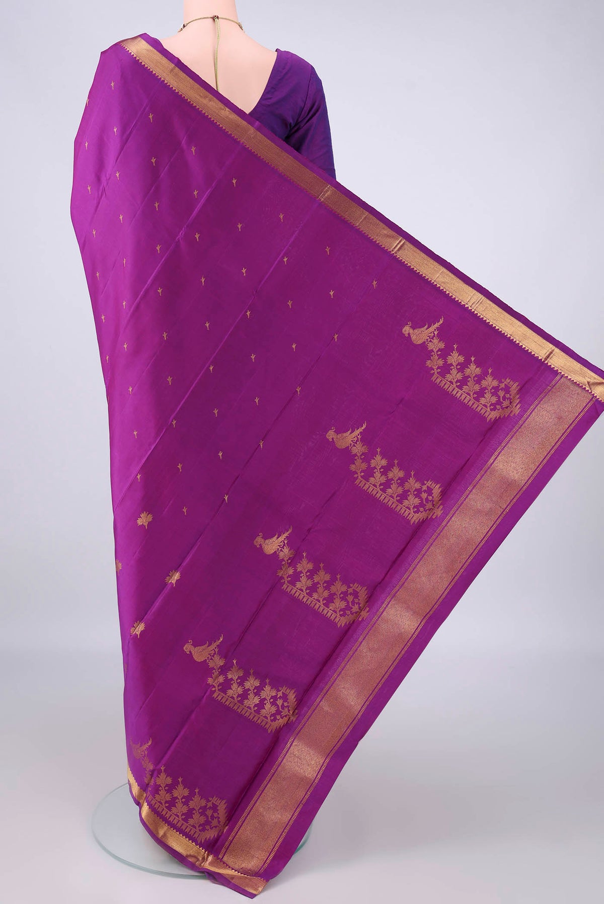 Flat view of Pure Silk Purple Kanjivaram Saree with Zari Butta on the body and Zari Border. 