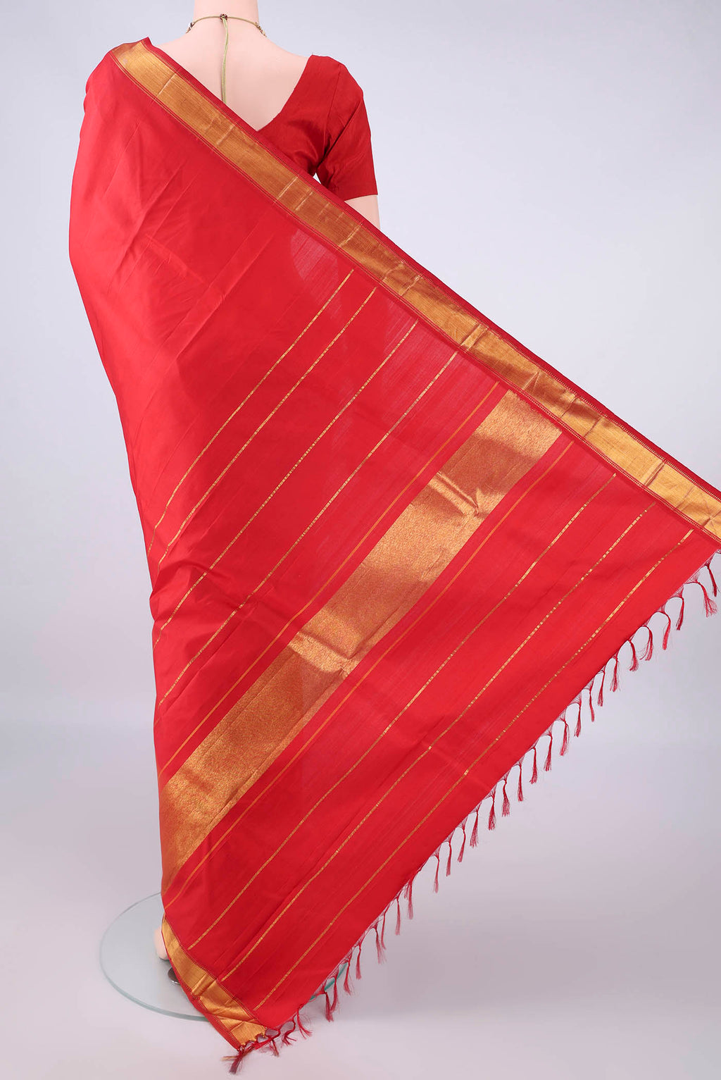 Flat view of Pure Silk Red Kanjivaram Saree with Plain Body and Zari Border. 