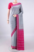 Pure Silk Grey Kanjivaram Saree with Plain Body and Thread Border.  displayed on a mannequin