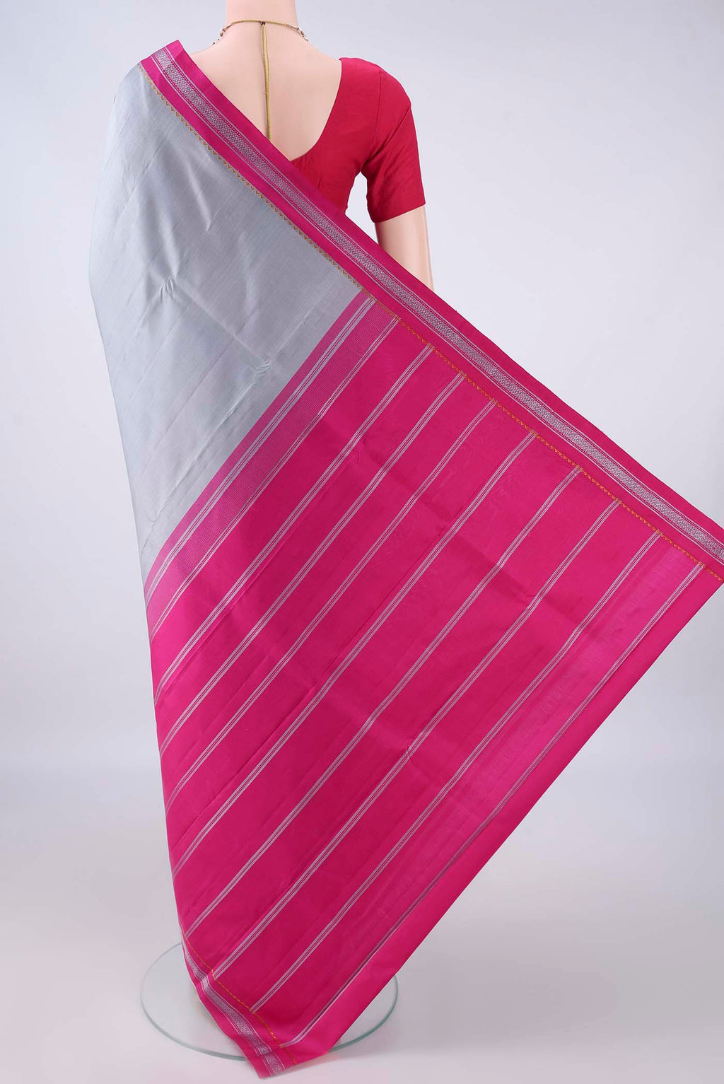 Flat view of Pure Silk Grey Kanjivaram Saree with Plain Body and Thread Border. 