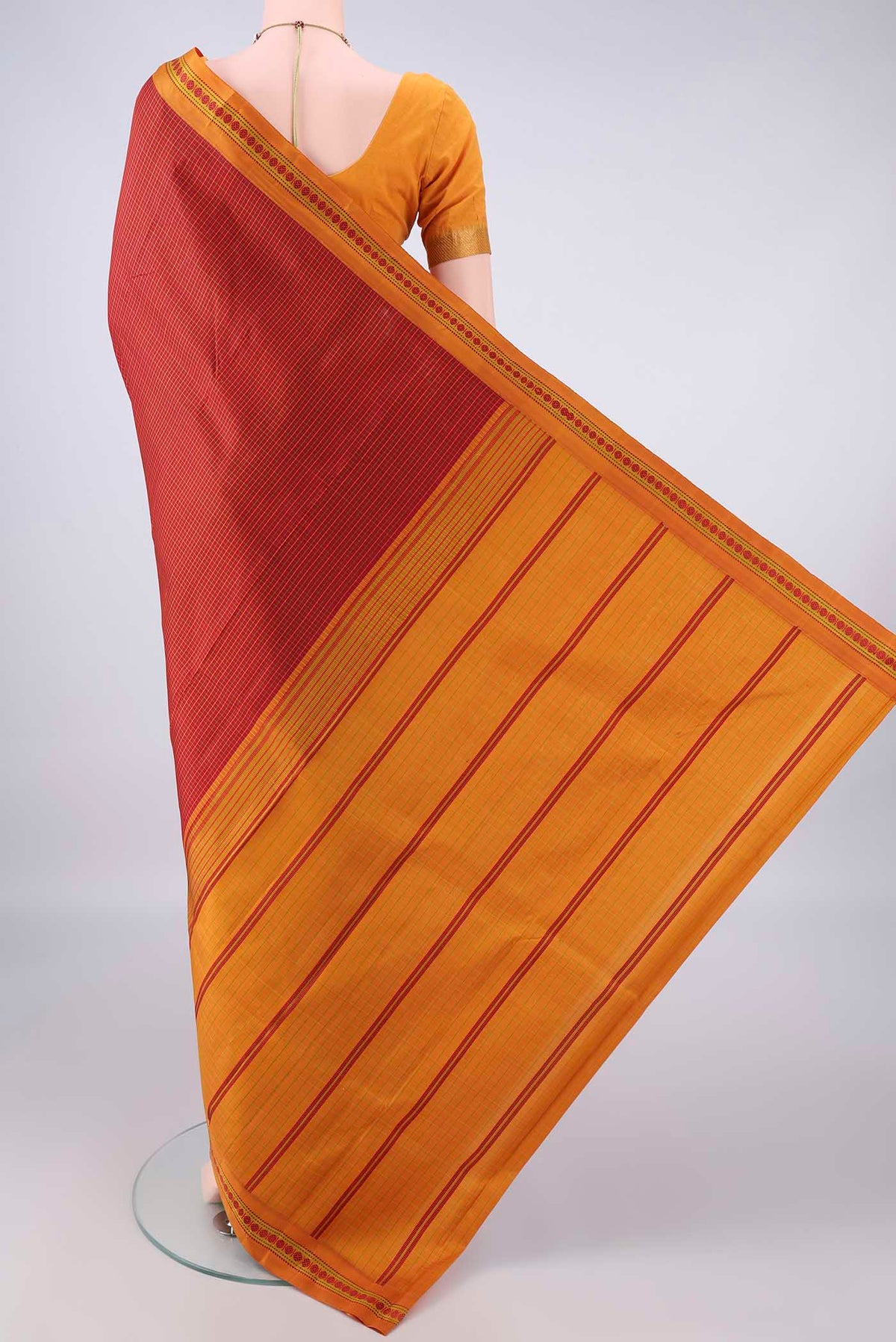 Flat view of Pure Silk Red Dual Tone Kanjivaram Saree with Checked design on the body and Thread Border. 