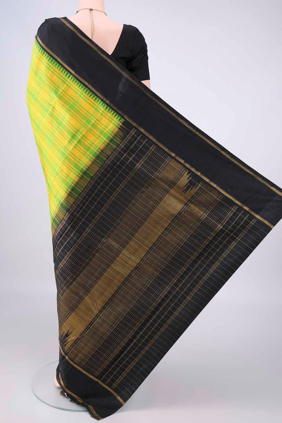 Flat view of Pure Silk Parrot Green Kanjivaram Saree with Checked design on the body and Zari Border. 
