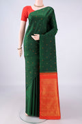 Pure Silk Green Kanjivaram Saree with Thread Butta on the body and Without Border.  displayed on a mannequin