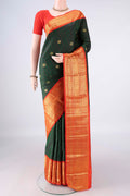 Pure Silk Bottle Green Kanchipuram Saree with Checked design on the body and Zari Border.  displayed on a mannequin