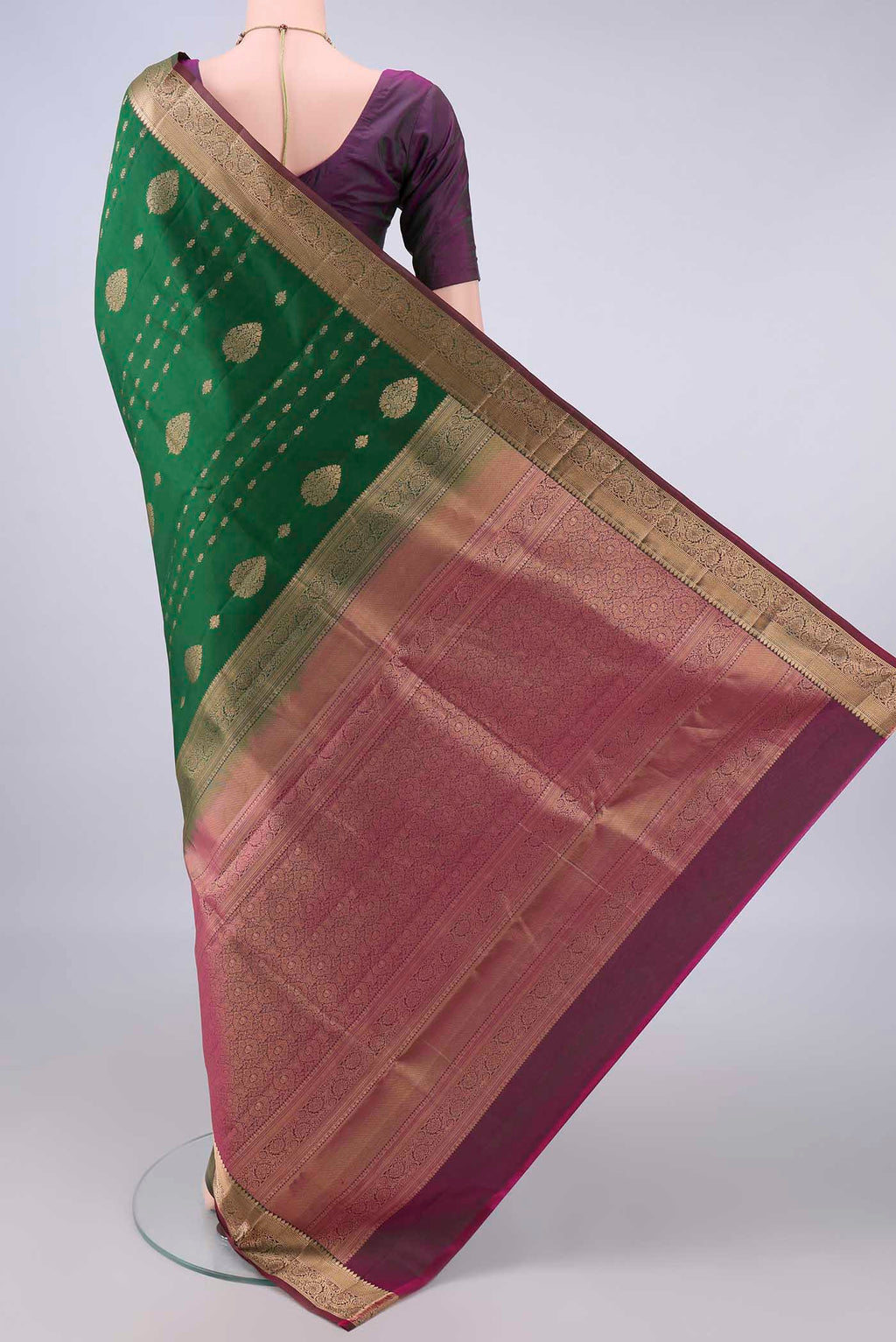 Flat view of Pure Silk Bottle Green Soft Saree with Zari Butta on the body and Zari Border. 