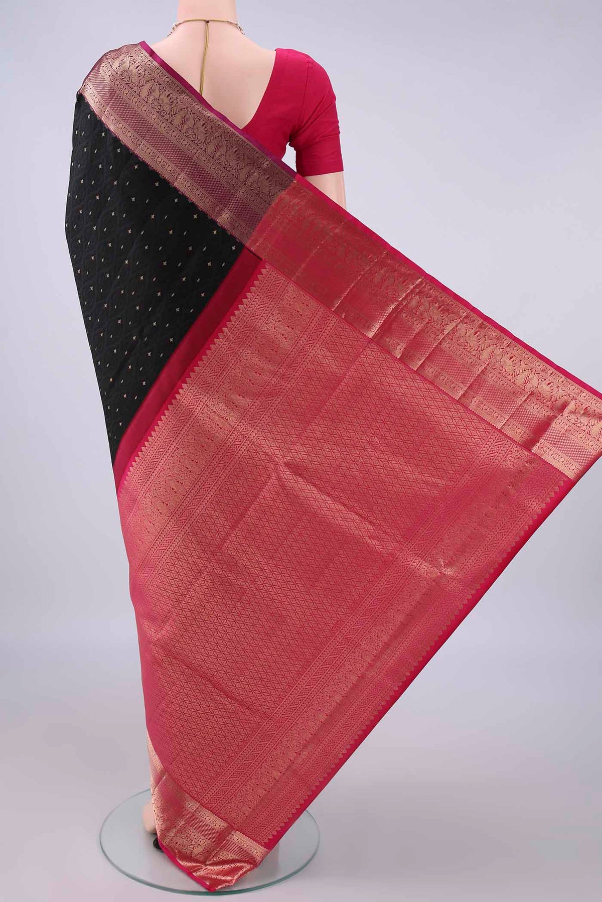 Flat view of Pure Silk Black Soft Saree with Jacquard With Zari Butta on the body and Zari Border. 