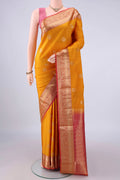 Pure Silk Yellow Soft Saree with Zari Butta on the body and Zari Border.  displayed on a mannequin