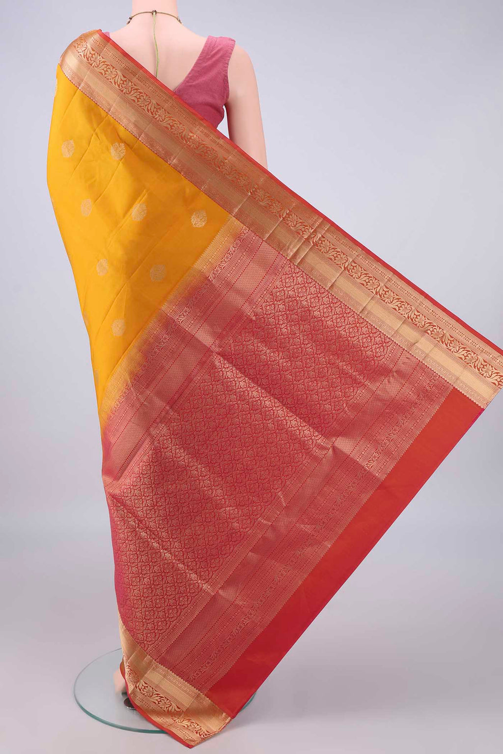 Flat view of Pure Silk Yellow Soft Saree with Zari Butta on the body and Zari Border. 