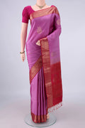 Pure Silk Pink Soft Saree with Zari Butta on the body and Zari Border.  displayed on a mannequin