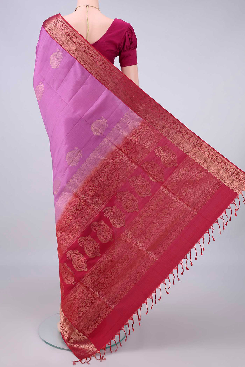 Flat view of Pure Silk Pink Soft Saree with Zari Butta on the body and Zari Border. 