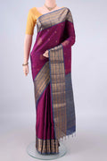 Pure Silk Magenta Soft Saree with Zari Butta on the body and Zari Border.  displayed on a mannequin