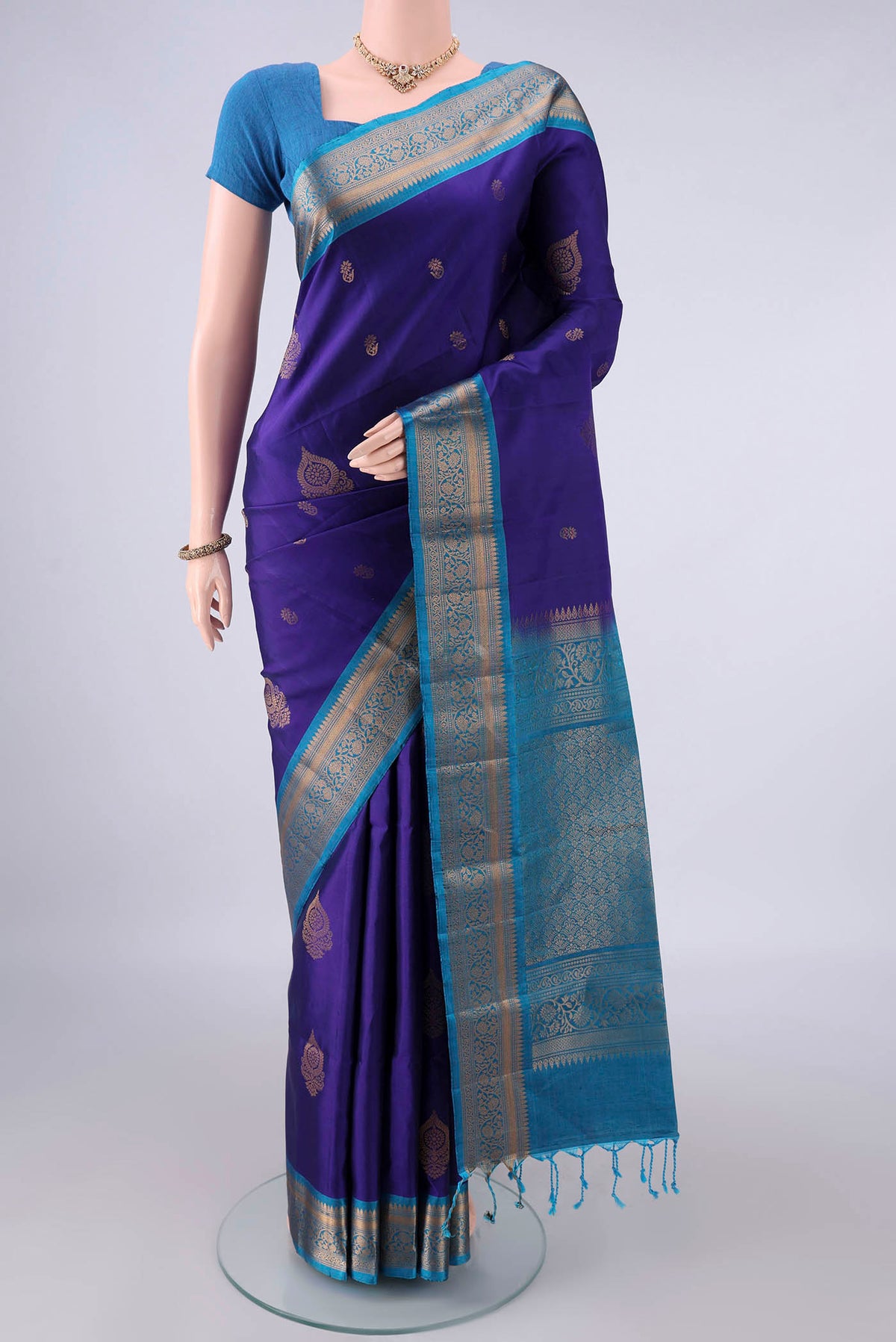 Pure Silk Dark Blue Soft Saree with Zari Butta on the body and Zari Border.  displayed on a mannequin