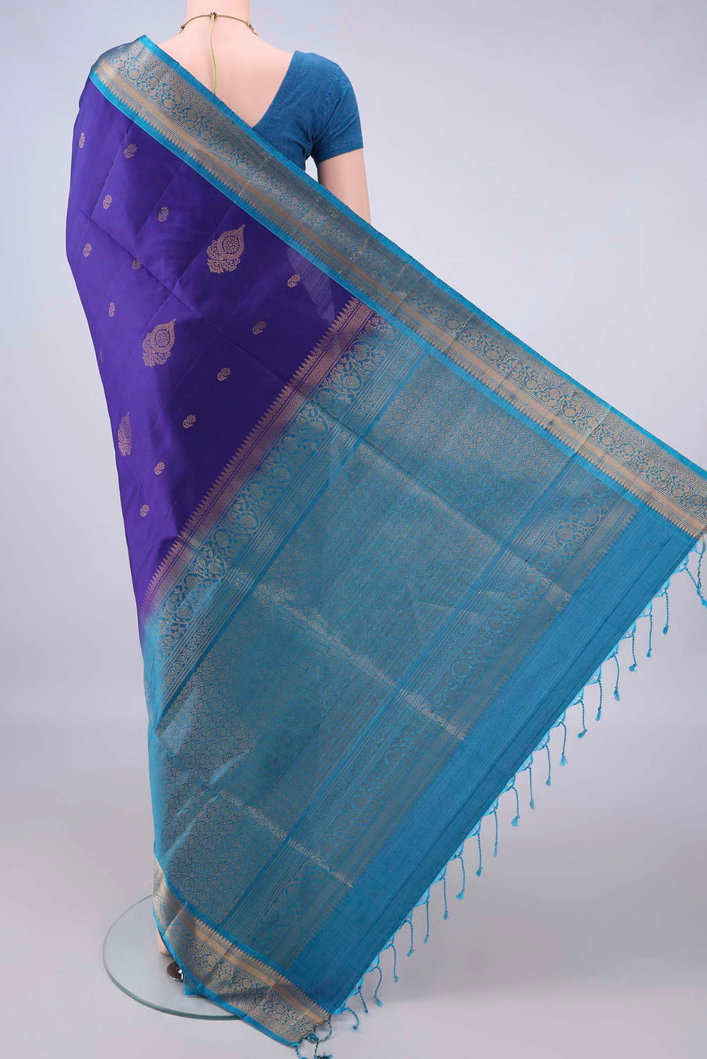 Flat view of Pure Silk Dark Blue Soft Saree with Zari Butta on the body and Zari Border. 