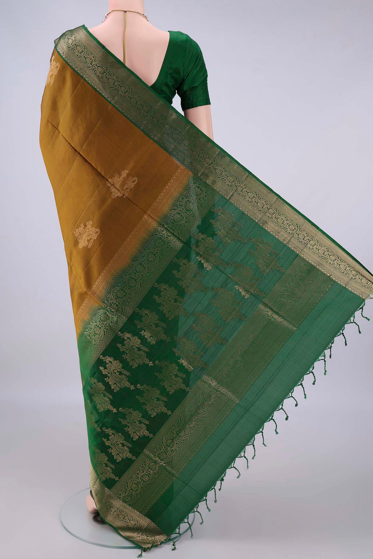 Flat view of Pure Silk Mehandi Green Soft Saree with Zari Butta on the body and Zari Border. 