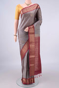 Pure Silk Grey Soft Saree with Zari Butta on the body and Zari Border.  displayed on a mannequin