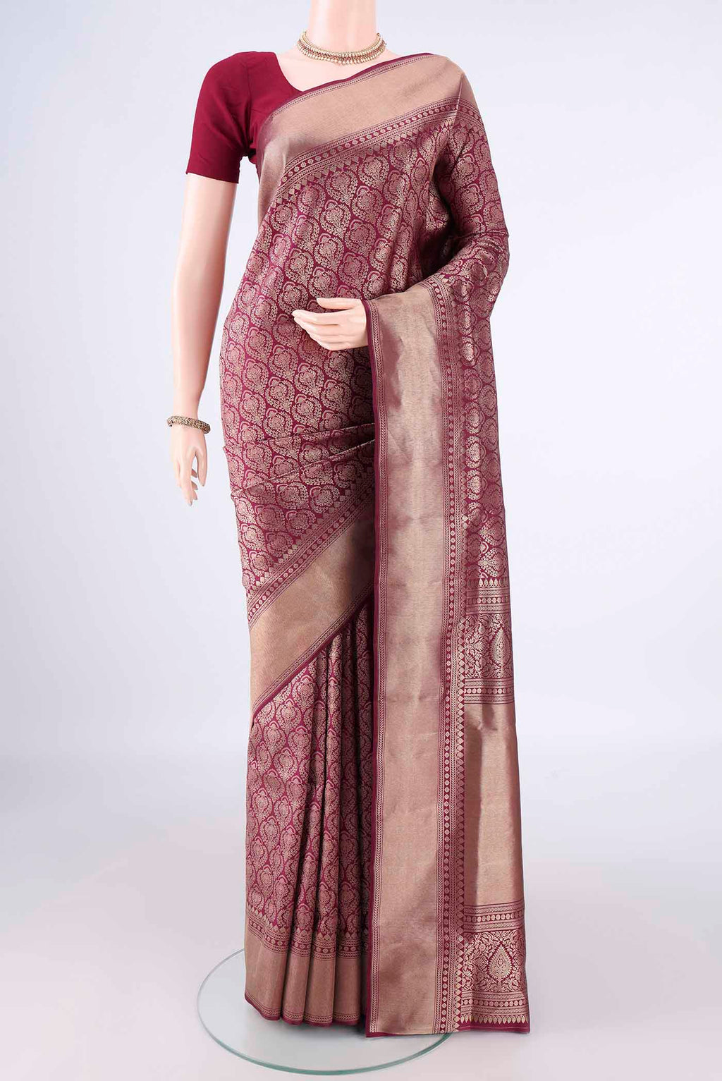 Pure Silk Maroon Soft Saree with Zari Brocade on the body and Zari Border.  displayed on a mannequin