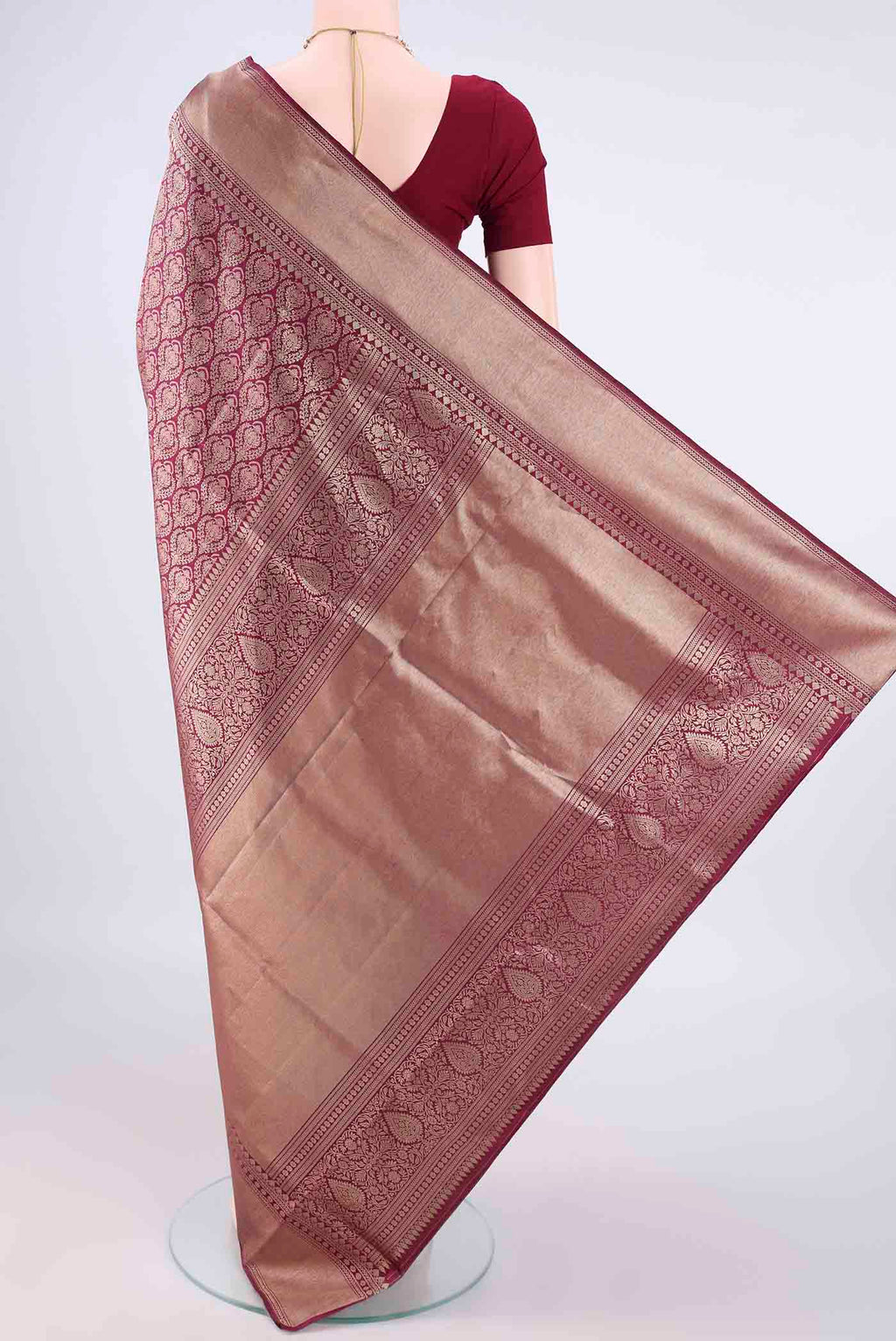 Flat view of Pure Silk Maroon Soft Saree with Zari Brocade on the body and Zari Border. 