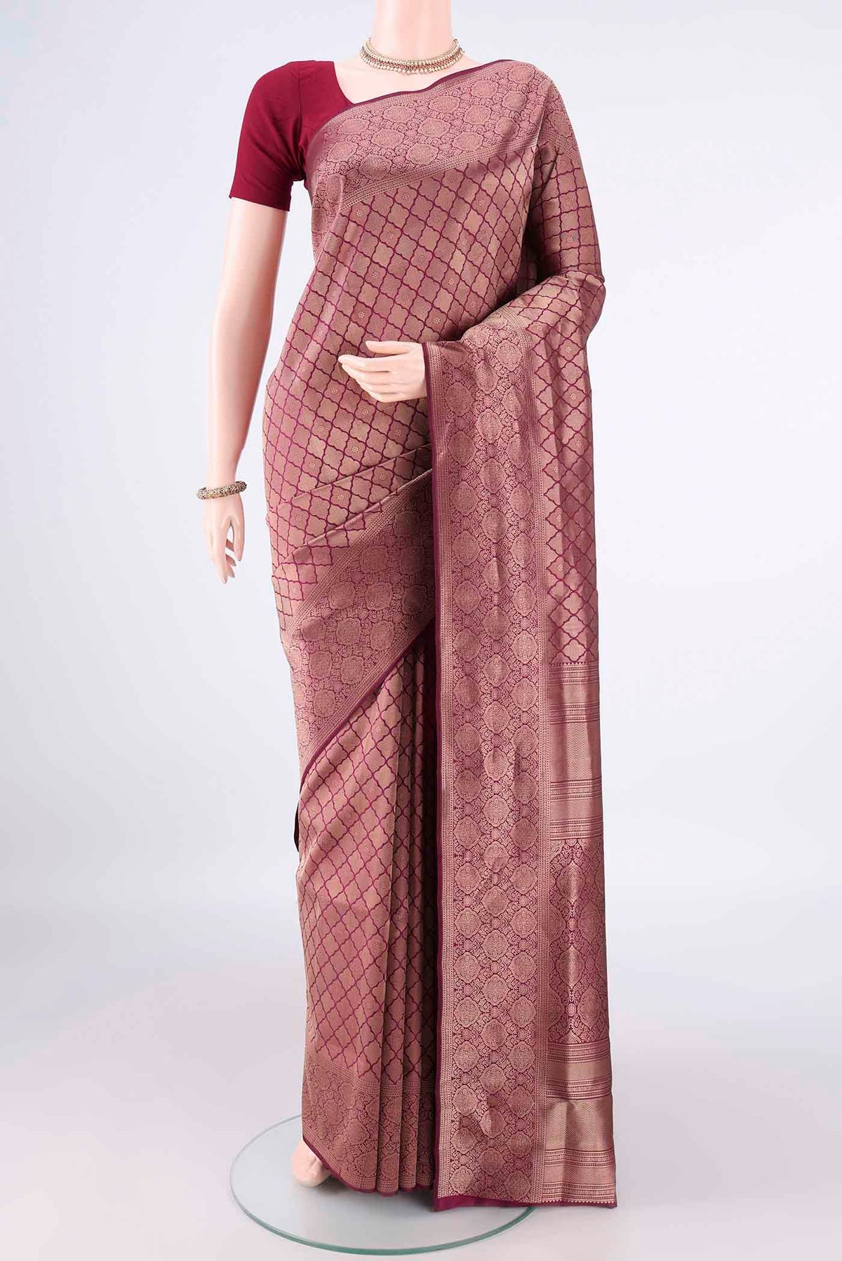 Pure Silk Burgundy Soft Saree with Zari Brocade on the body and Zari Border.  displayed on a mannequin