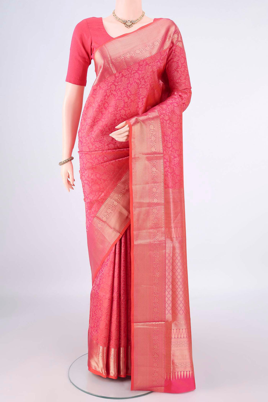 Pure Silk Pink Soft Saree with Zari Brocade on the body and Zari Border.  displayed on a mannequin