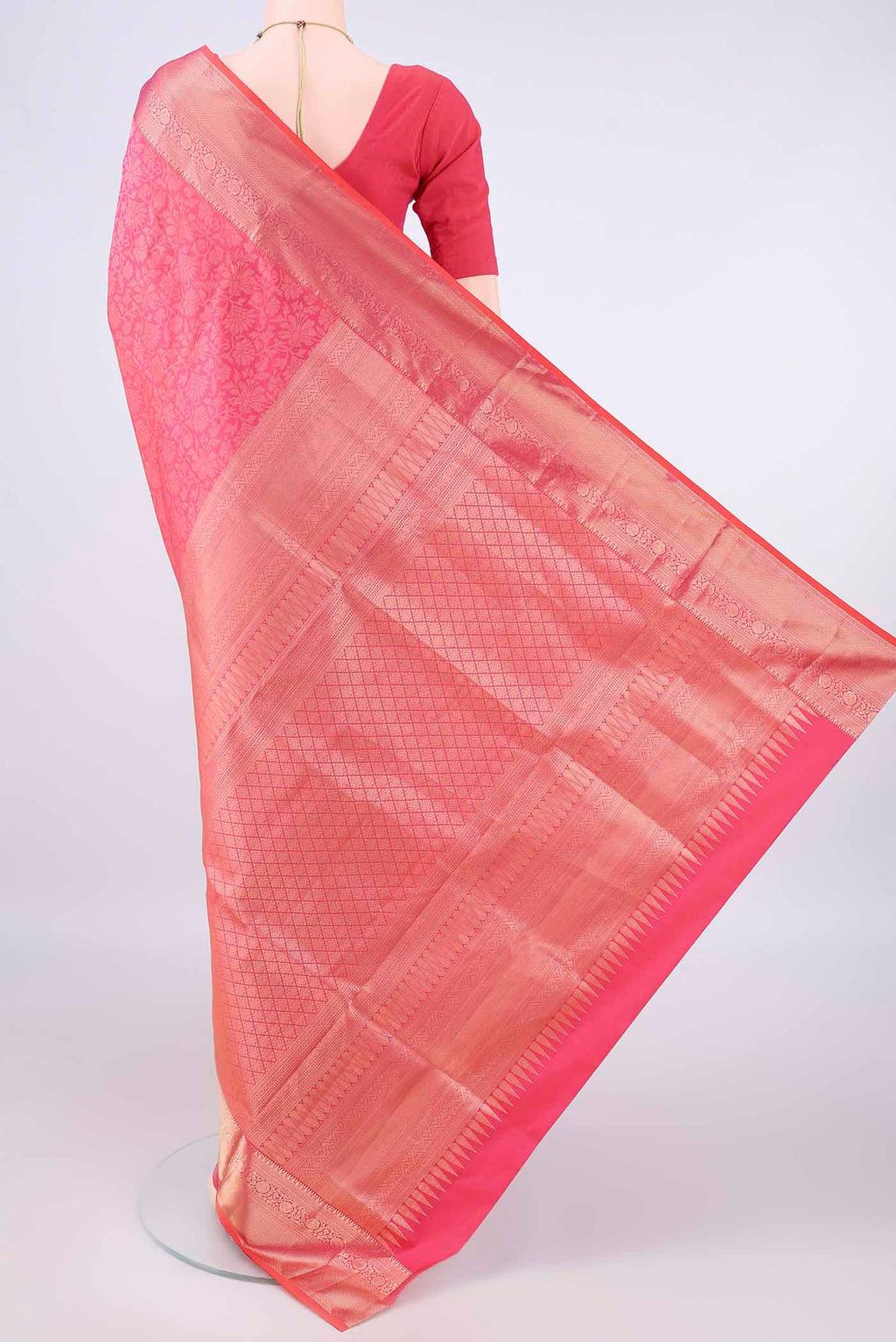 Flat view of Pure Silk Pink Soft Saree with Zari Brocade on the body and Zari Border. 