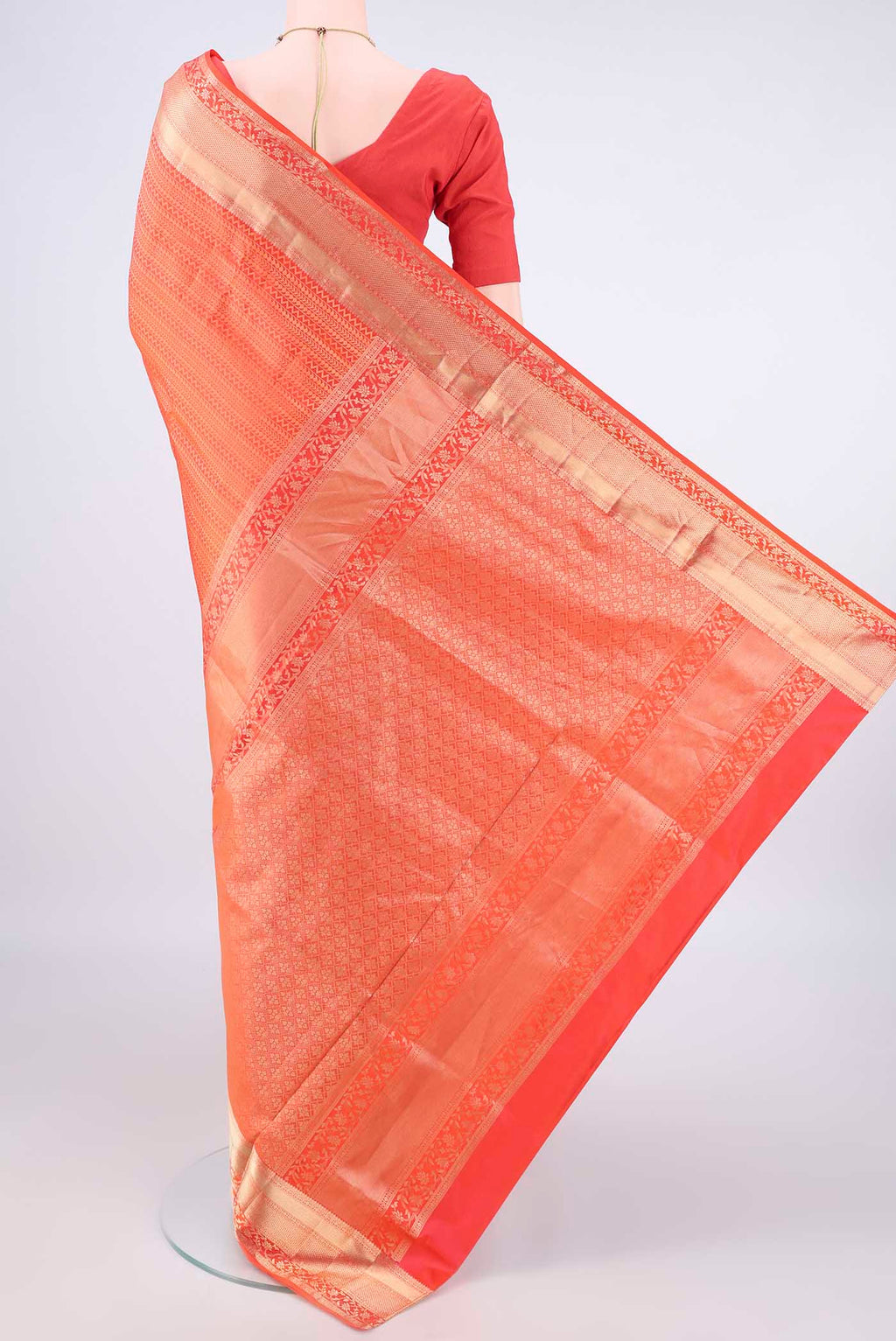 Flat view of Pure Silk Orange Soft Saree with Zari Brocade on the body and Zari Border. 