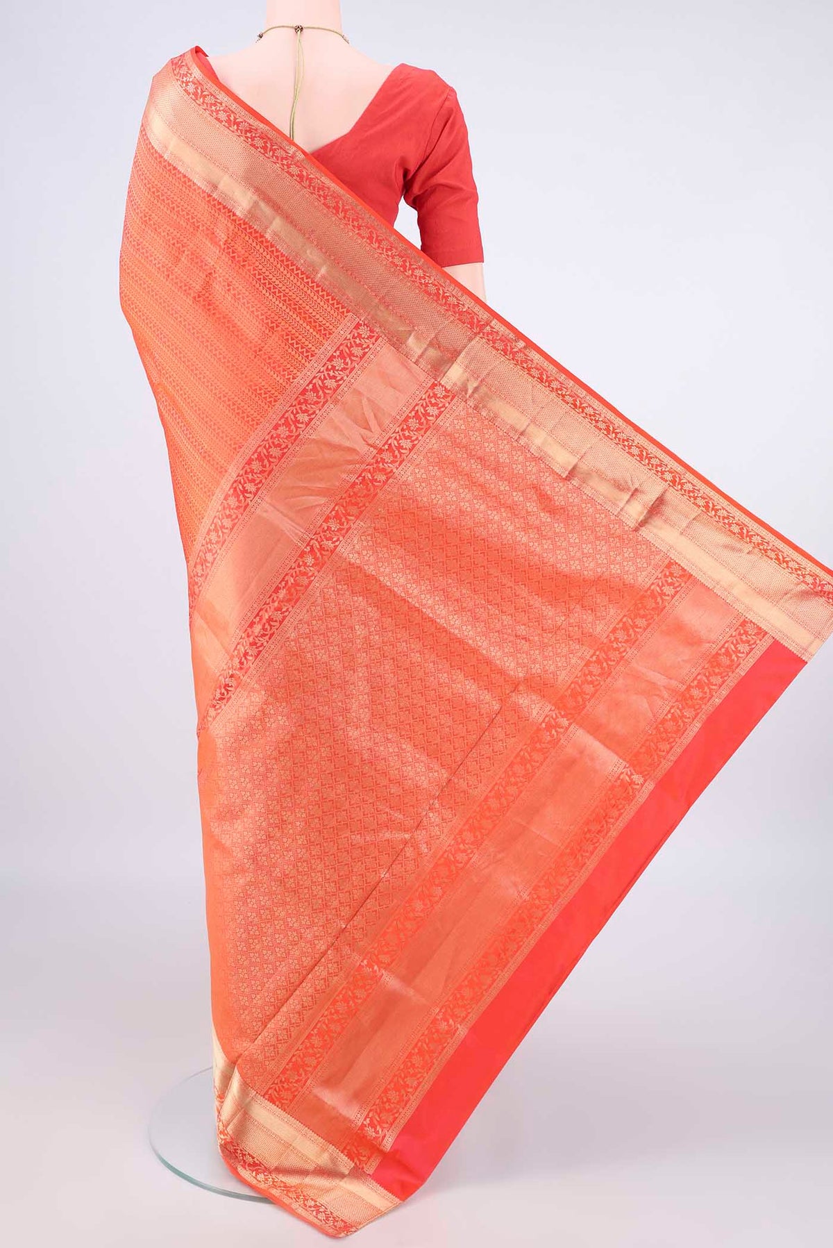 Flat view of Pure Silk Orange Soft Saree with Zari Brocade on the body and Zari Border. 