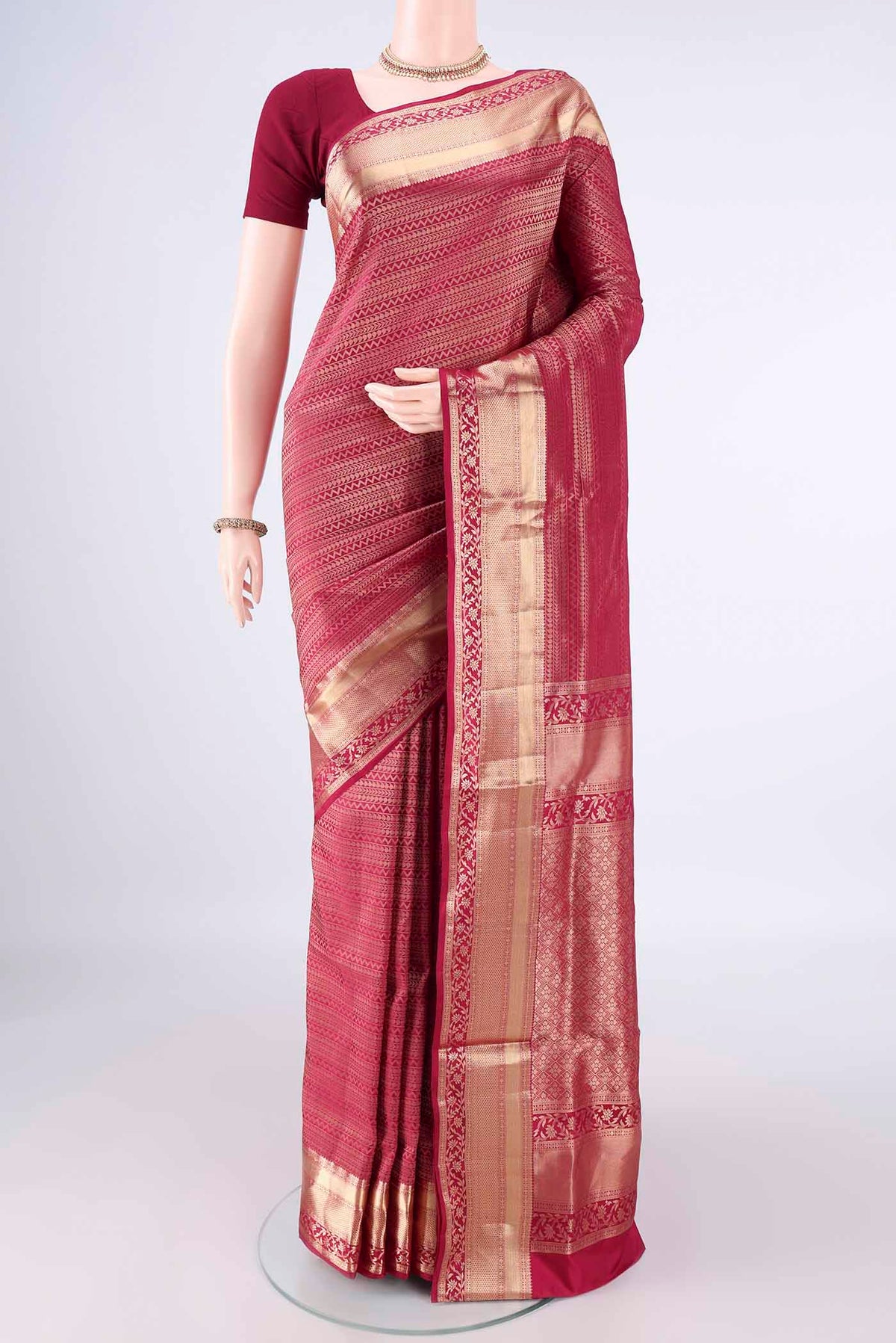 Pure Silk Magenta Soft Saree with Zari Brocade on the body and Zari Border.  displayed on a mannequin