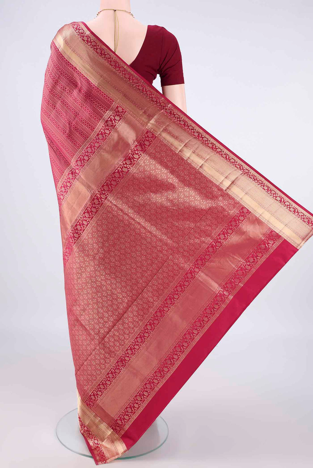 Flat view of Pure Silk Magenta Soft Saree with Zari Brocade on the body and Zari Border. 