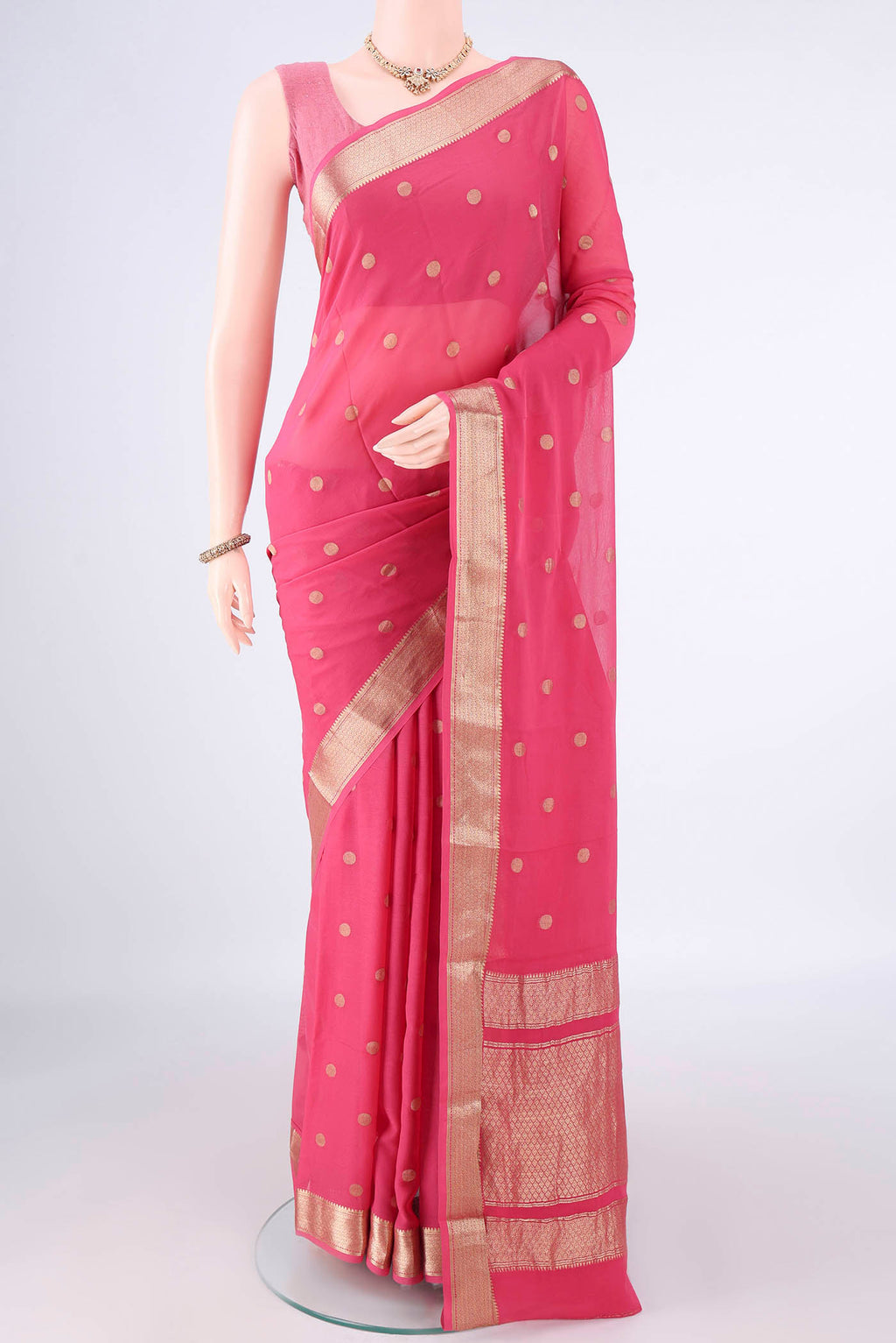 Pink Mysore Georgette Saree with Zari Butta on the body and Zari Border.  displayed on a mannequin