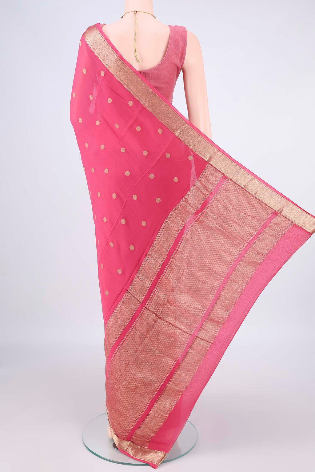Flat view of Pink Mysore Georgette Saree with Zari Butta on the body and Zari Border. 