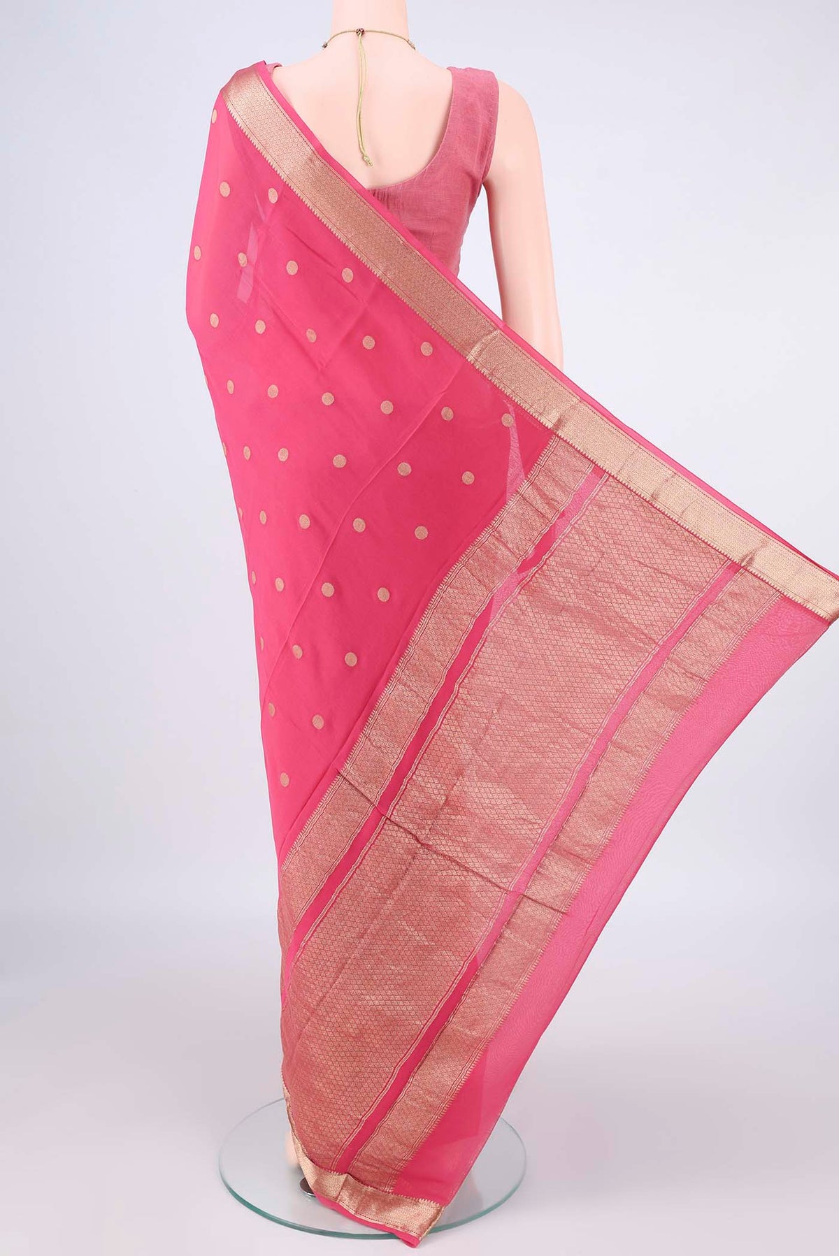 Flat view of Pink Mysore Georgette Saree with Zari Butta on the body and Zari Border. 