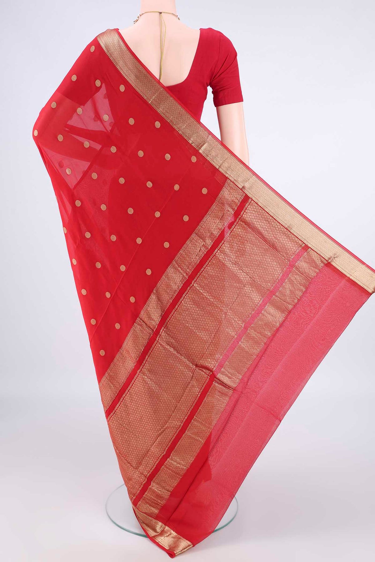 Flat view of Red Mysore Georgette Saree with Zari Butta on the body and Zari Border. 