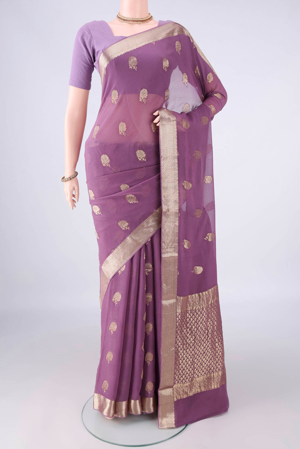 Lavender Mysore Georgette Saree with Zari Butta on the body and Zari Border.  displayed on a mannequin