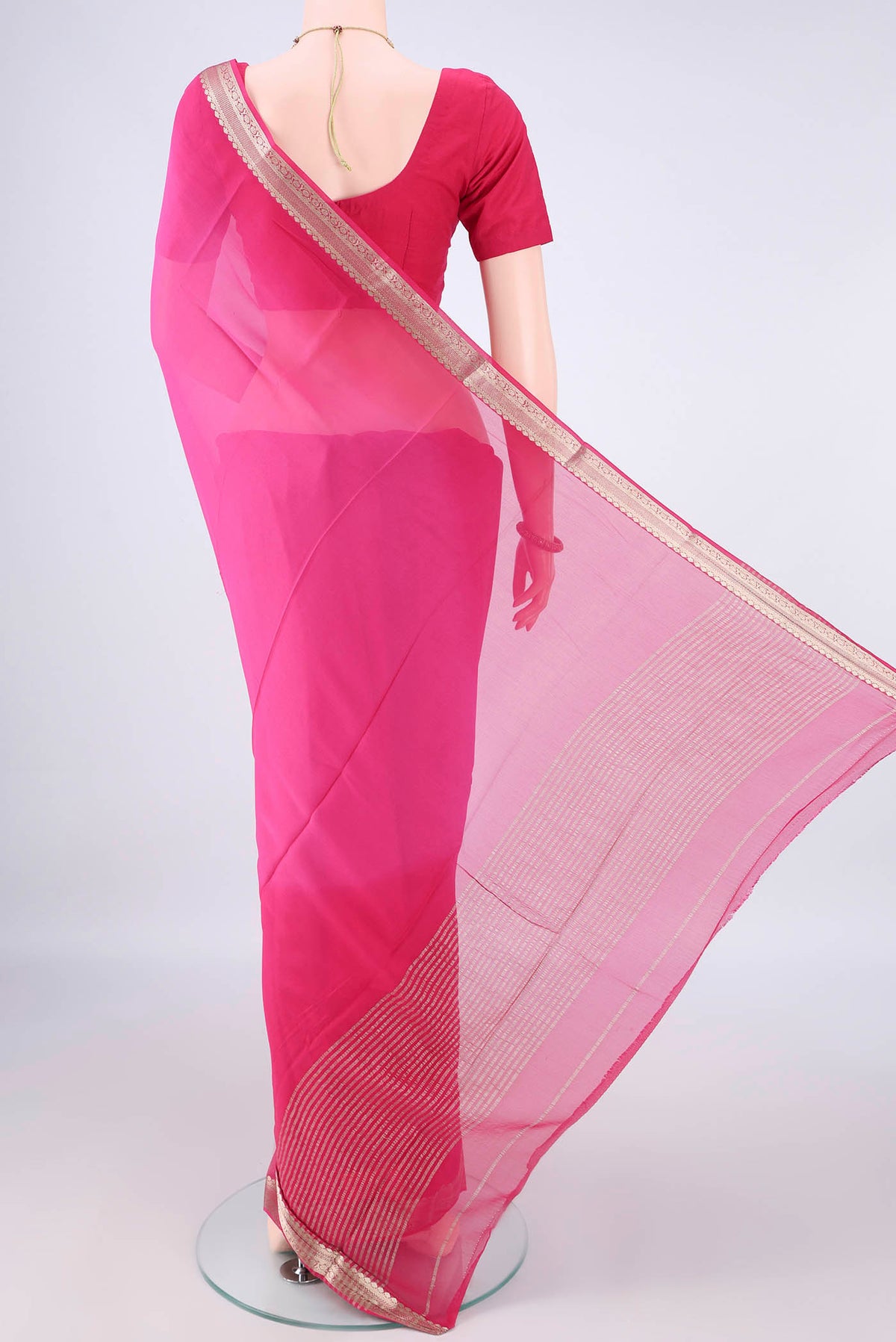 Flat view of Rani Pink Mysore Georgette Saree with Plain Body and Zari Border. 