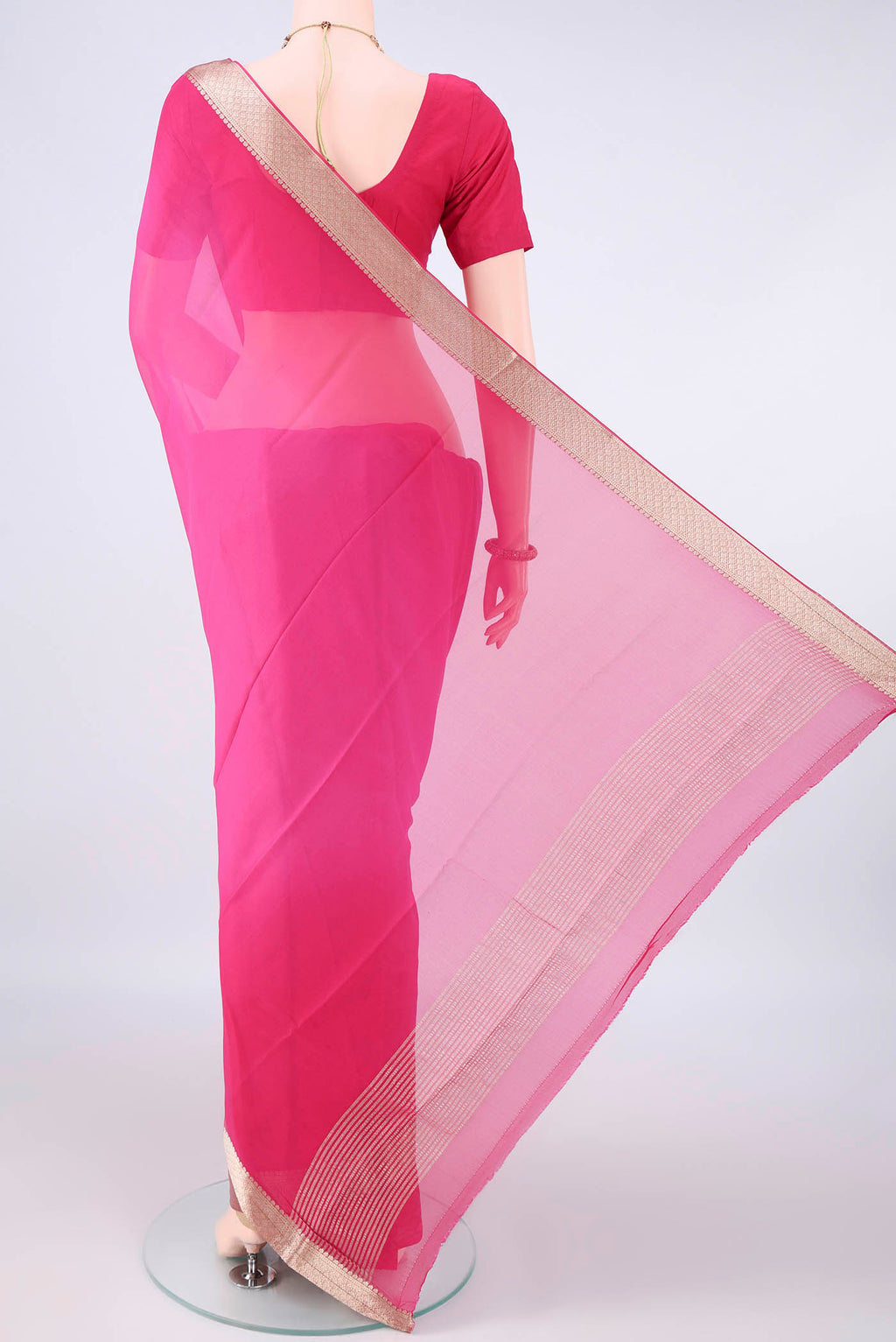 Flat view of Rani Pink Mysore Georgette Saree with Plain Body and Zari Border. 