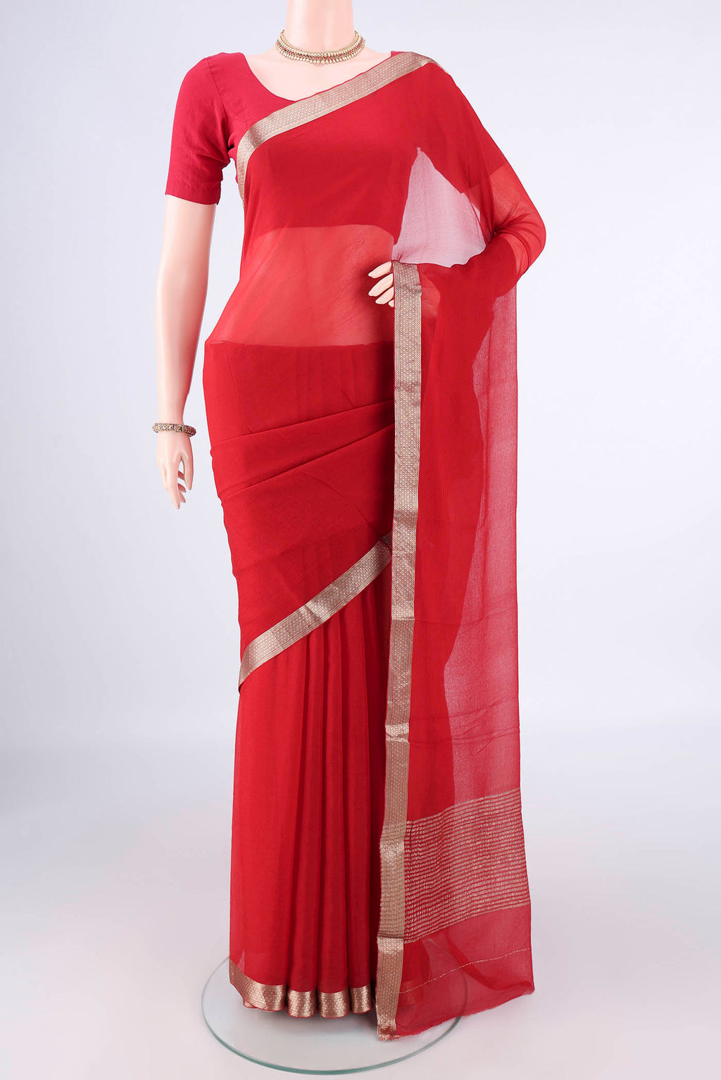 Red Mysore Chiffon Saree with Plain Body and Zari Border.  displayed on a mannequin