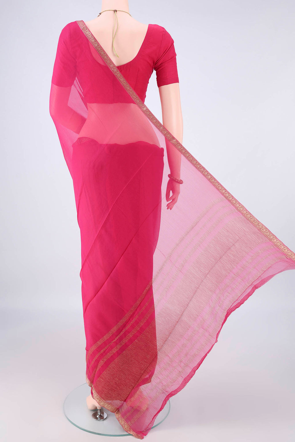 Flat view of Rani Pink Mysore Chiffon Saree with Plain Body and Zari Border. 
