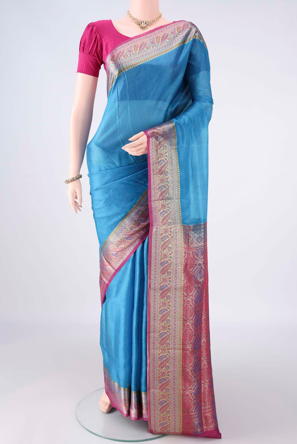 Blue Banarasi Tussar Saree with Plain Body and Zari Border.  displayed on a mannequin
